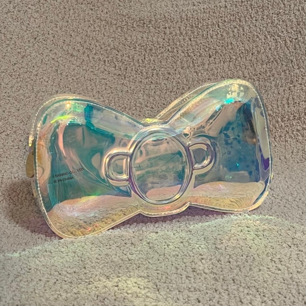 Stoney Clover Lane Hello Kitty bow shaped iridescent pouch.